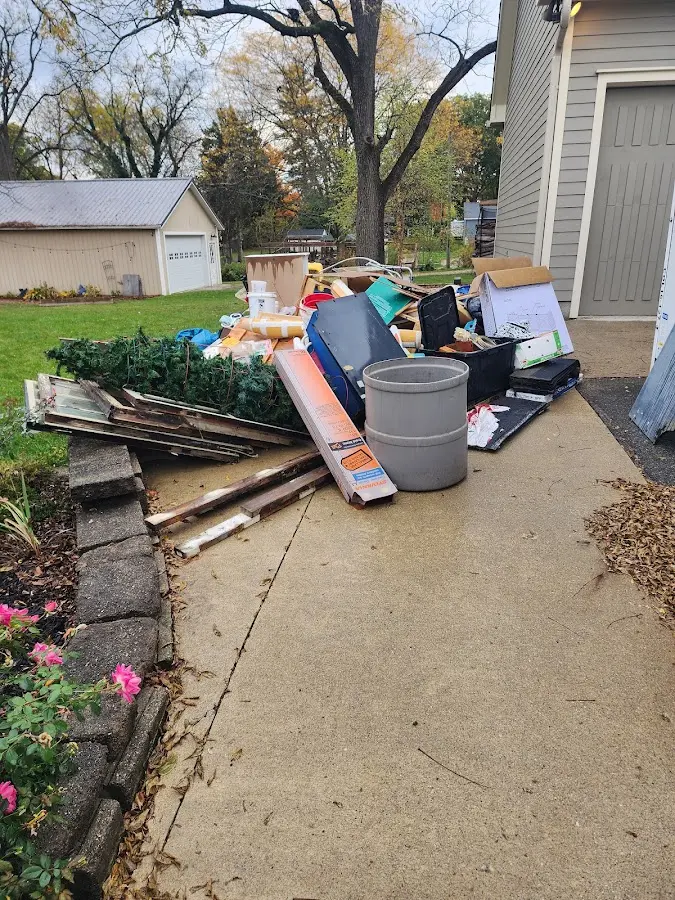 Dumpster being loaded with debris for Residential Dumpster Rental in Anna